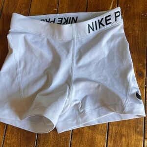 White Nike Pro shorts.